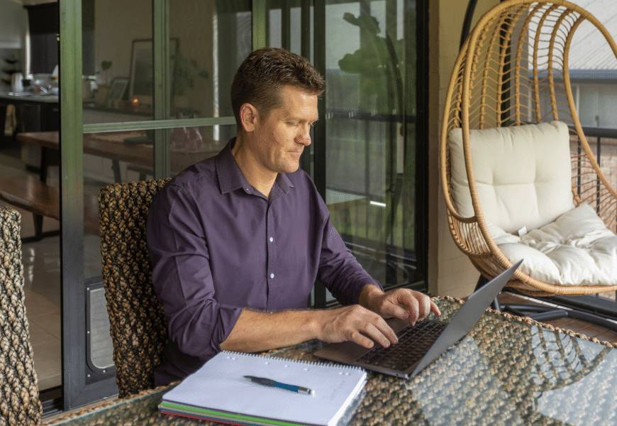 man-working-from-home-on-balcony